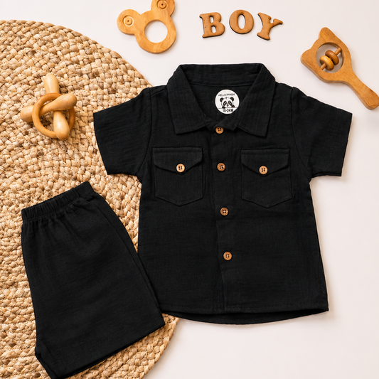 A baby boy's two-piece clothing set consisting of a black short-sleeve button-up shirt and matching black shorts,