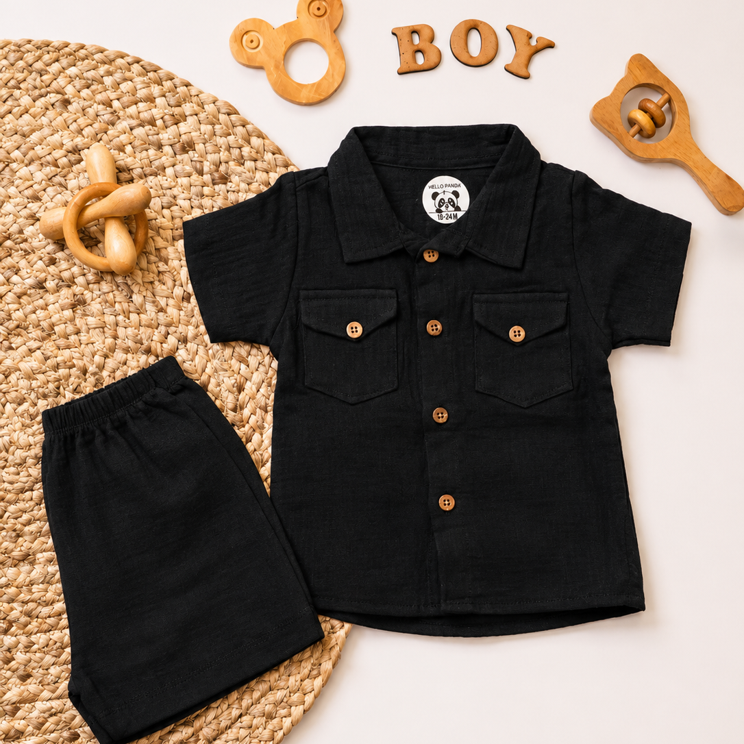 A baby boy's two-piece clothing set consisting of a black short-sleeve button-up shirt and matching black shorts,
